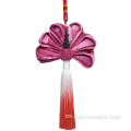 Bolsita étnica con colgante de borla de pavo real de algodón tie-dye